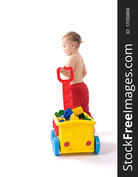 Little girl is sitting on the floor and playing with blocks. Little girl is sitting on the floor and playing with blocks