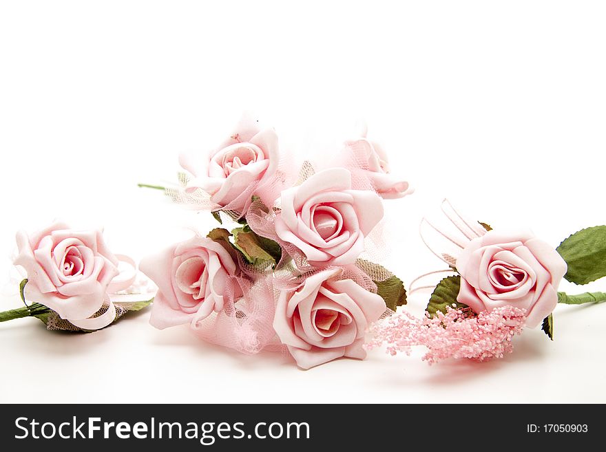Pink bunch of roses onto white background