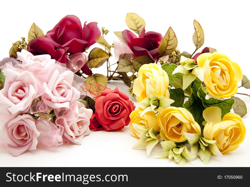Pink and yellow bunch of roses with red rose
