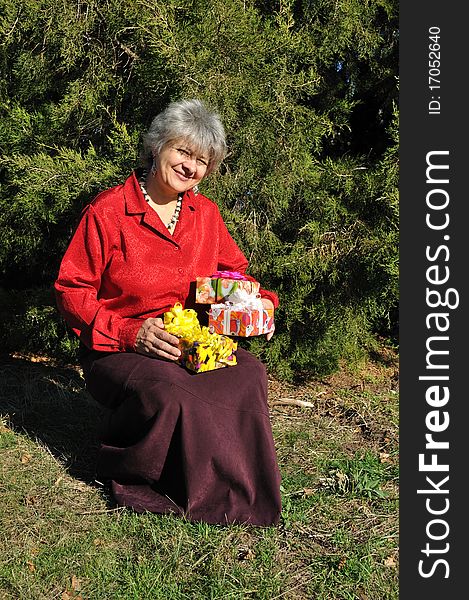 Lucky, An Elderly Woman Holds A Lot Of Gifts