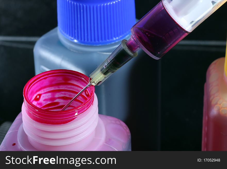 Ink cartridges with syringes and colored injection