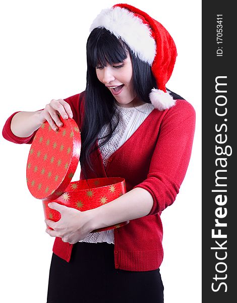 Pretty girl in red hat opens box with gift on white. Pretty girl in red hat opens box with gift on white
