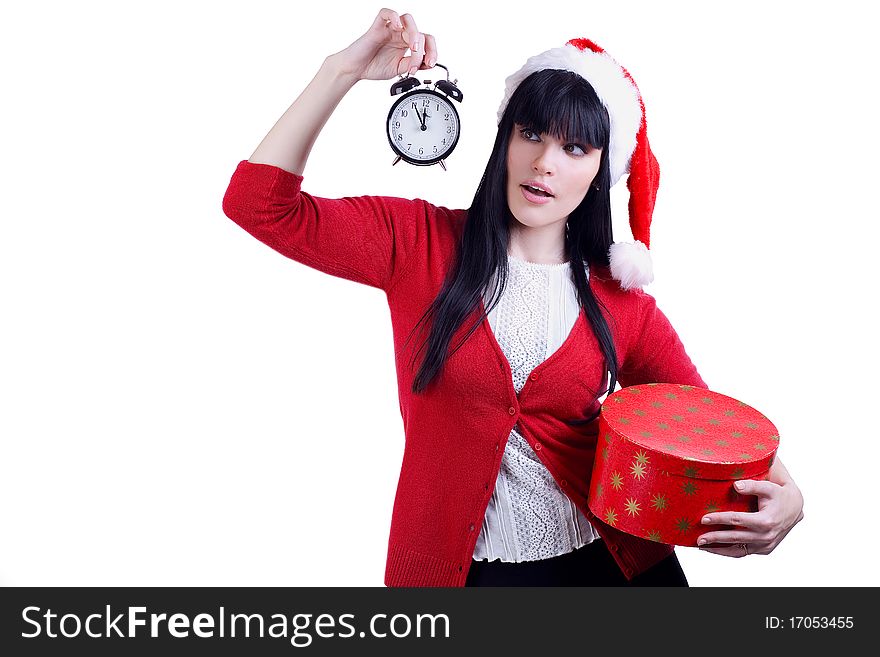 Pretty girl in red hat with alarm clock and box on white. Pretty girl in red hat with alarm clock and box on white