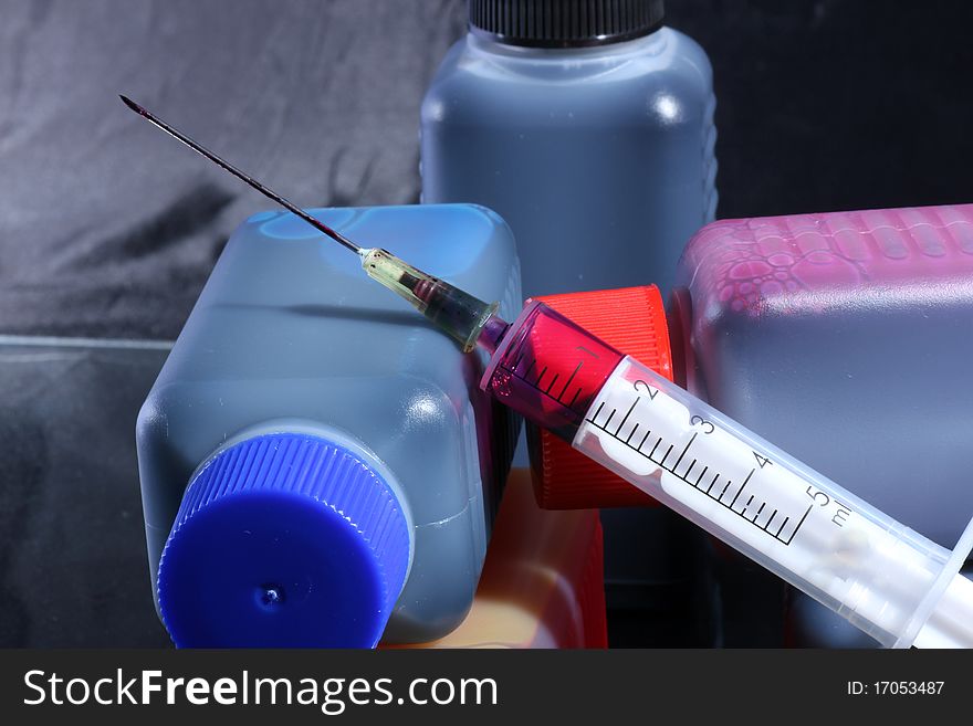 Ink cartridges with syringes and colored injection