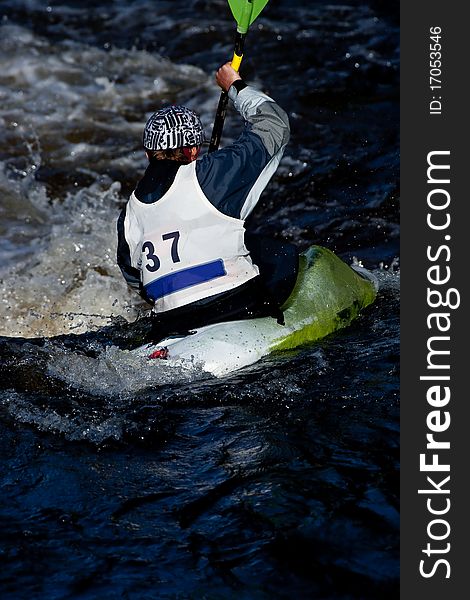 Competition of kayak freestyle on whitewater