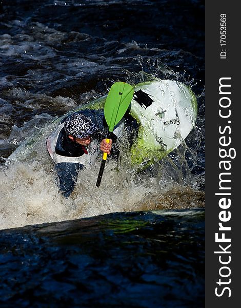 Competition of kayak freestyle on whitewater