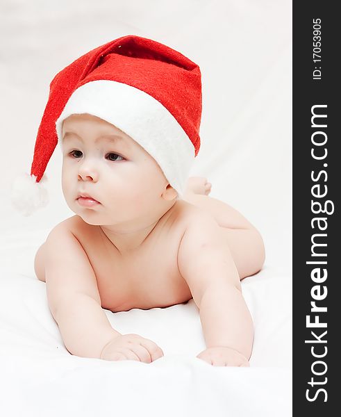 Newborn baby in Santa Claus hat