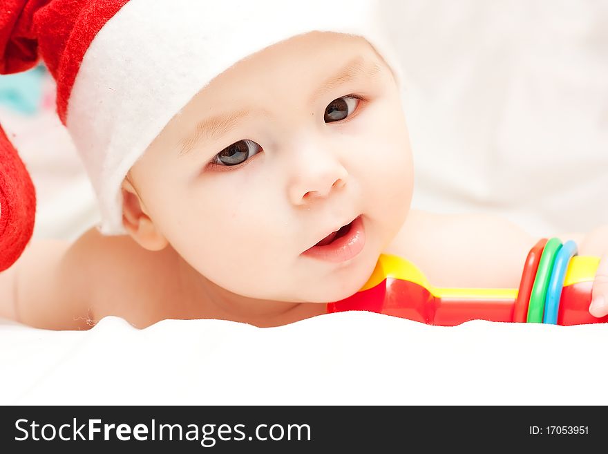 Small Newborn baby in Santa Claus hat