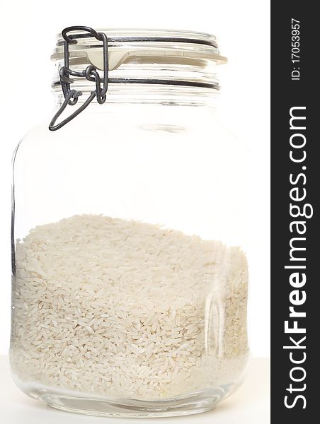 Rice in jar on white background