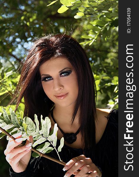 Portrait of beautiful young girl in green leaves. Portrait of beautiful young girl in green leaves