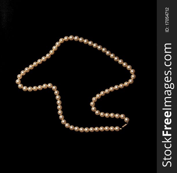 Studio photo of white pearls on black background
