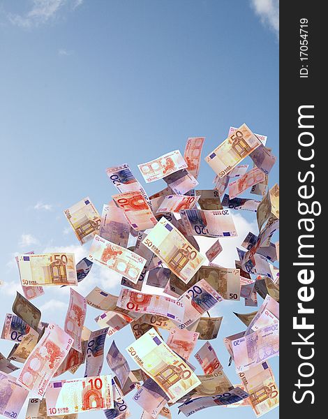 Different euro bills flying in the sky