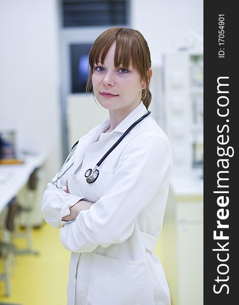 Portrait of a successful young female doctor, looking confident(color toned image)
