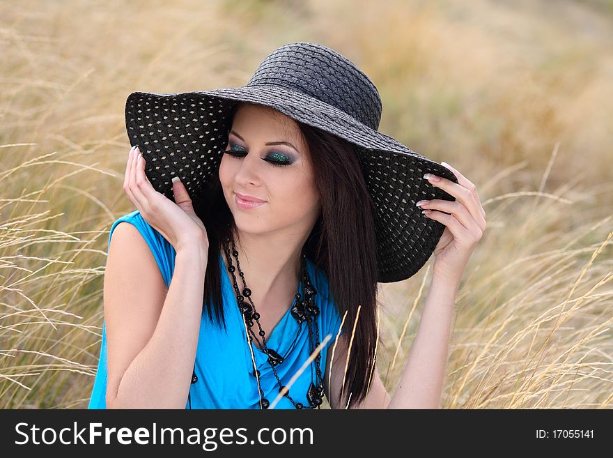 Portrait of a young cheerful girl in stylish bonnet. Portrait of a young cheerful girl in stylish bonnet