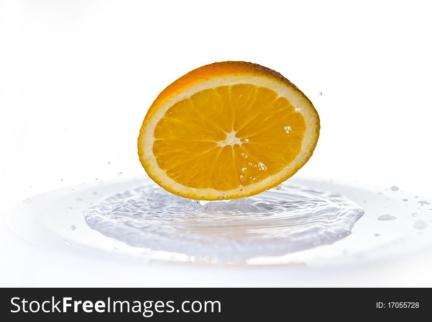 Fruits falling in water on white background