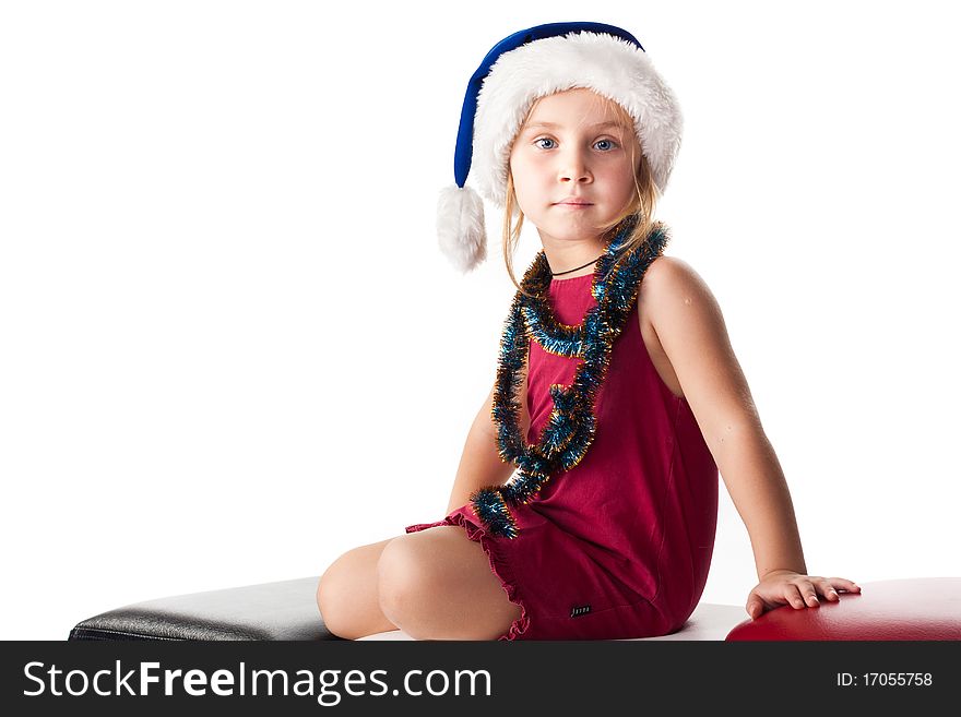 Girl in Santa's hat and tinsel