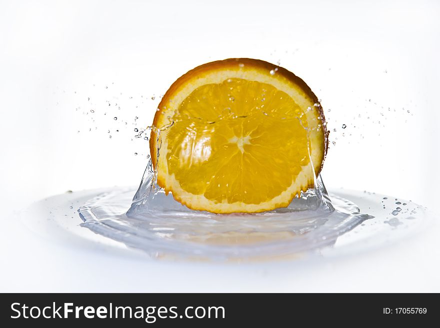 Fruits falling in water on white background