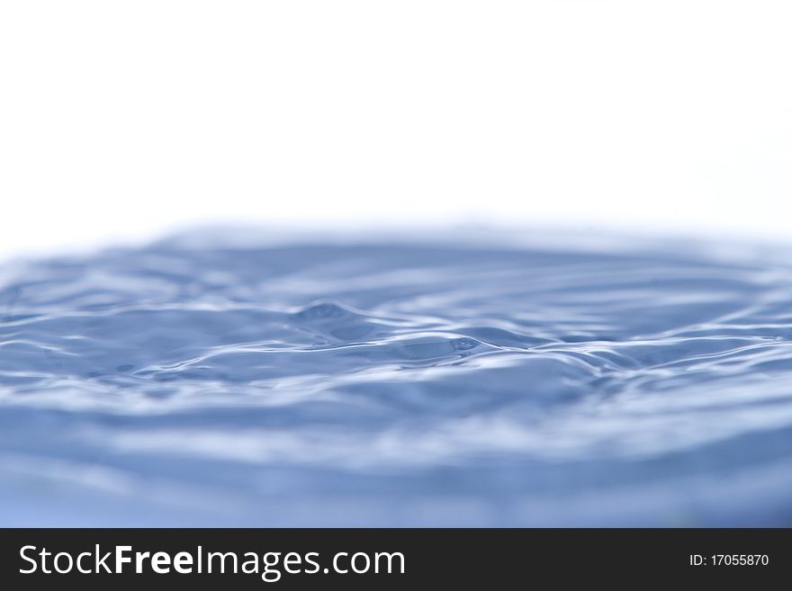 Water in motion on white background