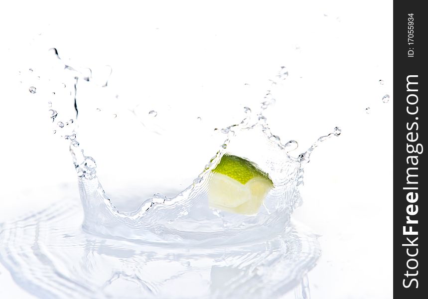 Fruits falling in water on white background