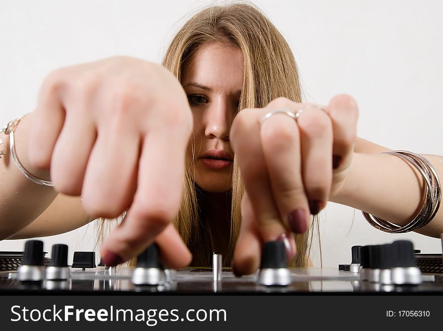 Female DJ Adjusting Sound Levels