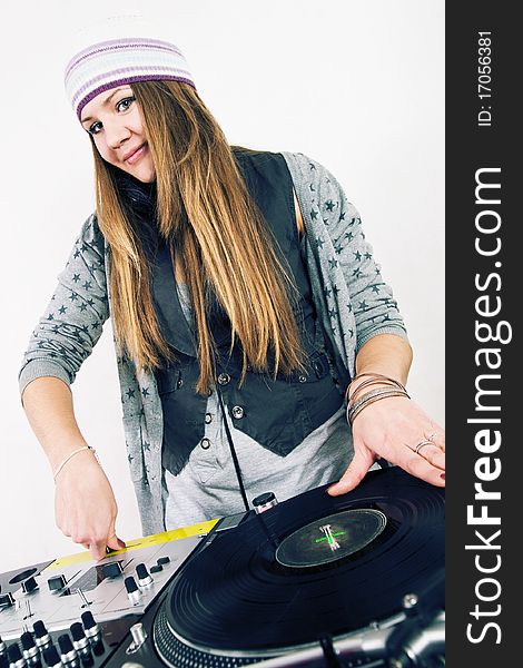 Young attractive teenage girl playing music from turntable. Young attractive teenage girl playing music from turntable