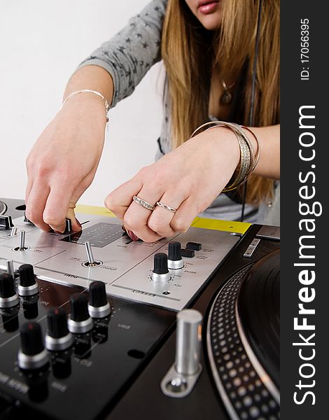 Hands of a disc jockey girl playing music from vinyl. Hands of a disc jockey girl playing music from vinyl