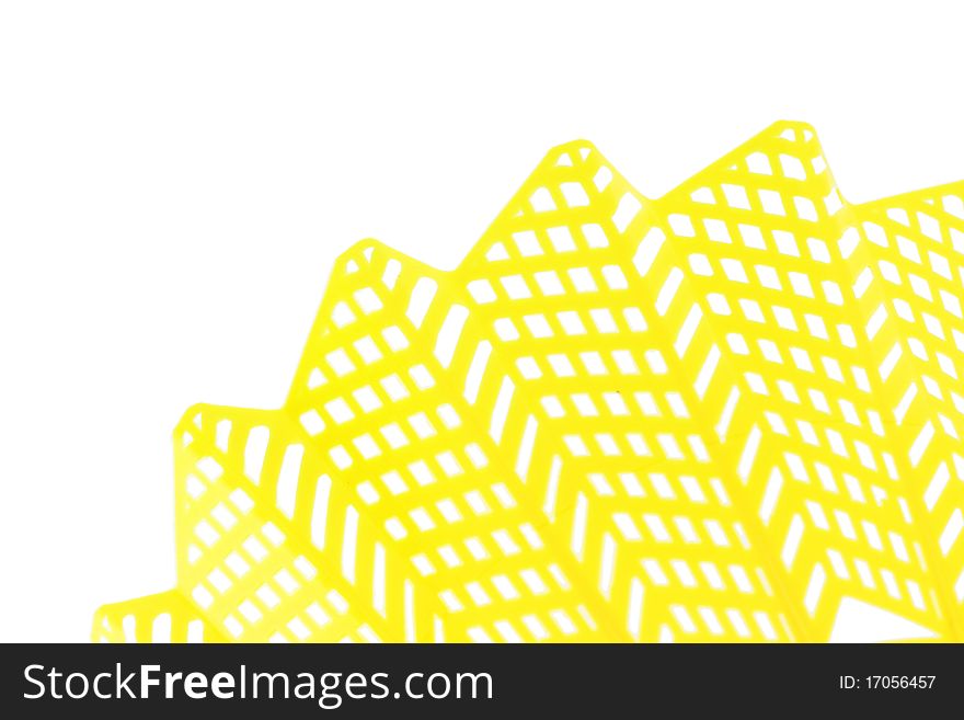 Bright yellow badminton birdie skirt isolated on white as a background.