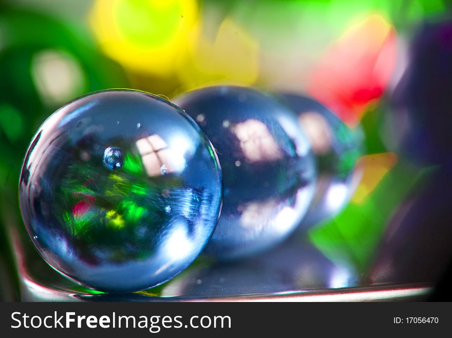 Marbles on colorfull blurred background