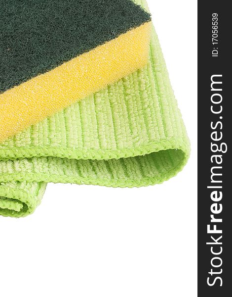 Green cloth fabric with synthetic yellow sponge for cleaning the room.