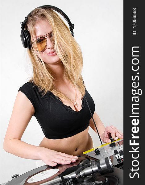 Young attractive teenage girl playing music from turntable. Young attractive teenage girl playing music from turntable