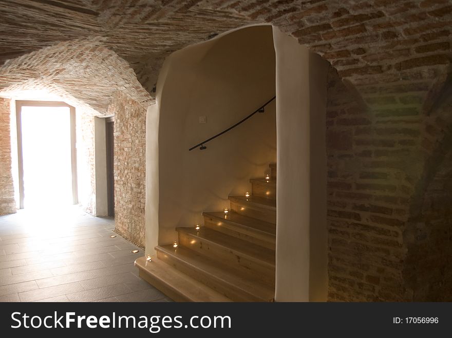 Stairs in an old building leading into the cellar.