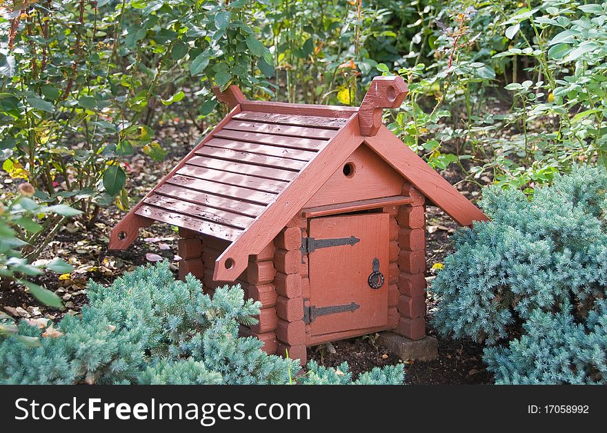 Small wooden small house in a garden. Small wooden small house in a garden