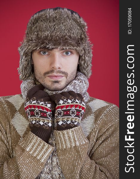 Portrait of man in fur winter hat and sweater. Portrait of man in fur winter hat and sweater