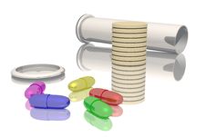 Vial And Colored Tablets And Pills Stock Photo