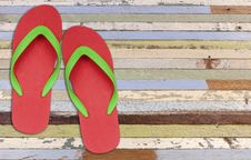 Red And Green Flip Flop Sandals On Old Wood Stock Photos Red And Green Flip Flop Sandals On Old Wood Stock Photos