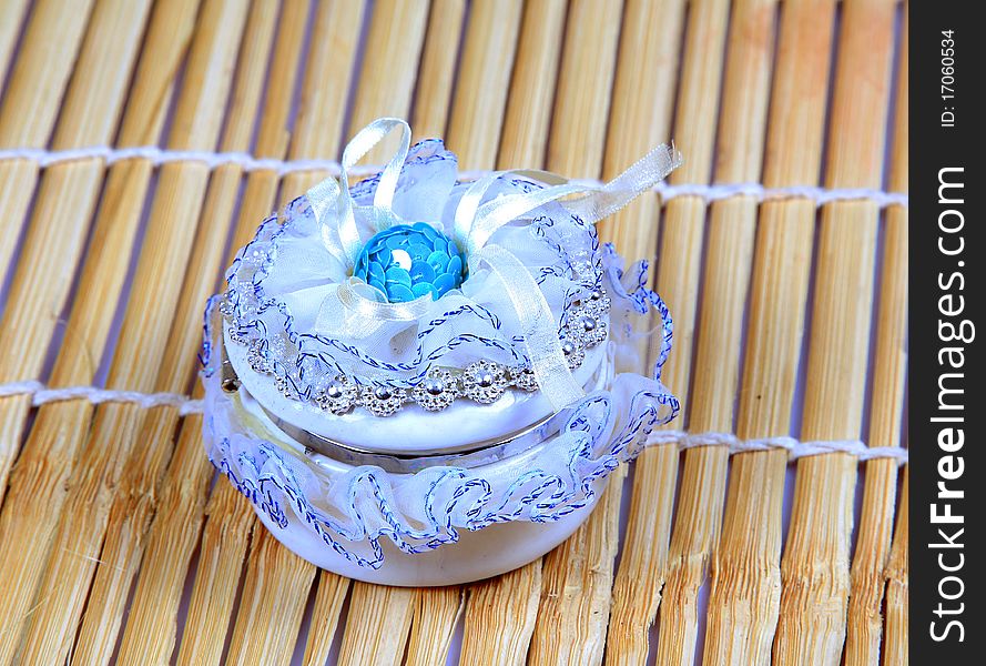 Cute jewellery box over wooden background.