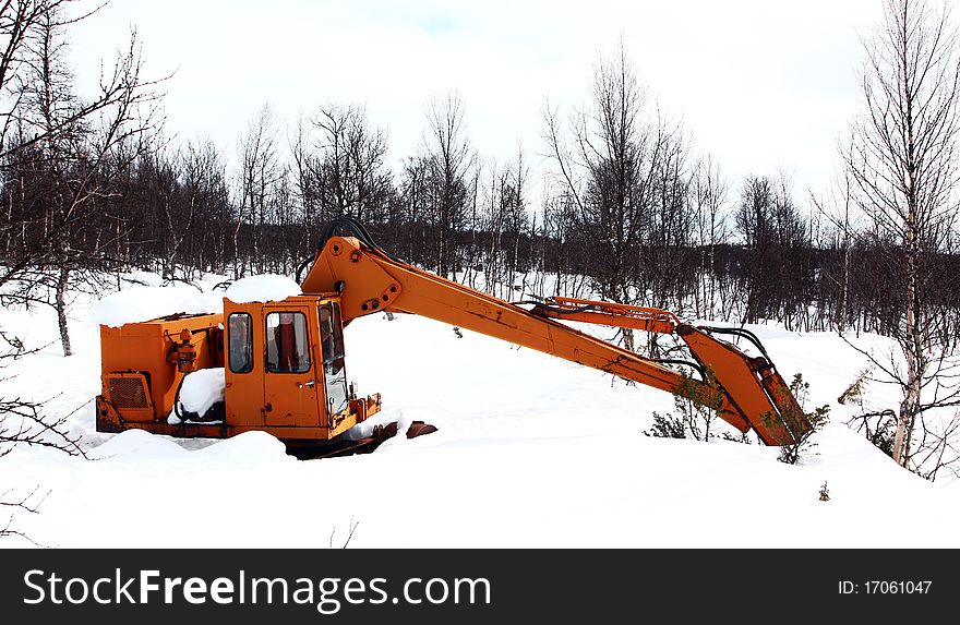 An old excavator in the forest