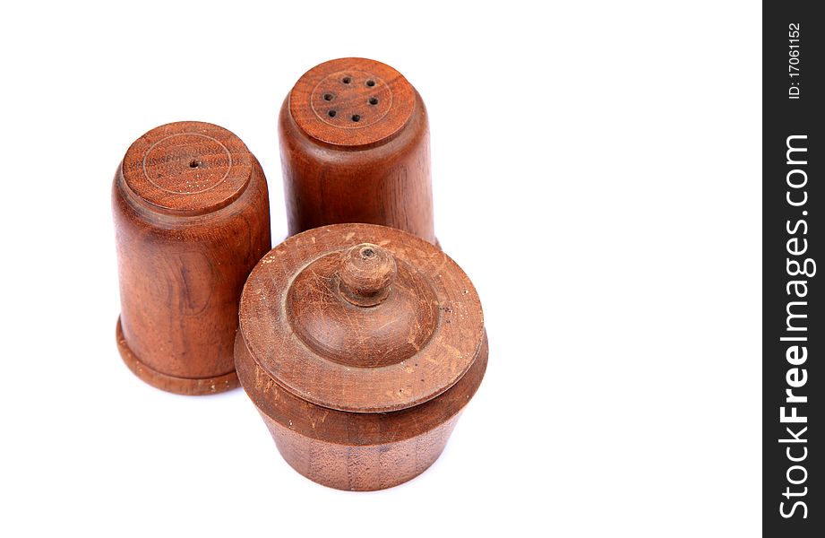 Wooden salt and pepper containers isolated on white background.