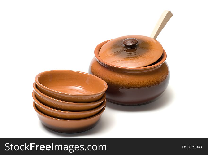 Brown ceramic ware on a white background. Brown ceramic ware on a white background.
