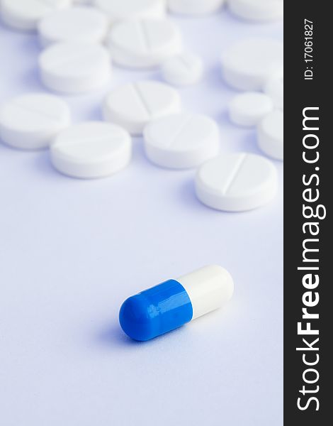 Tablets And Capsule On A White Background