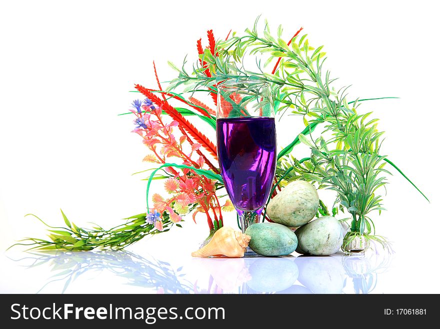 Mint mocktail glass with natural plants on white background.