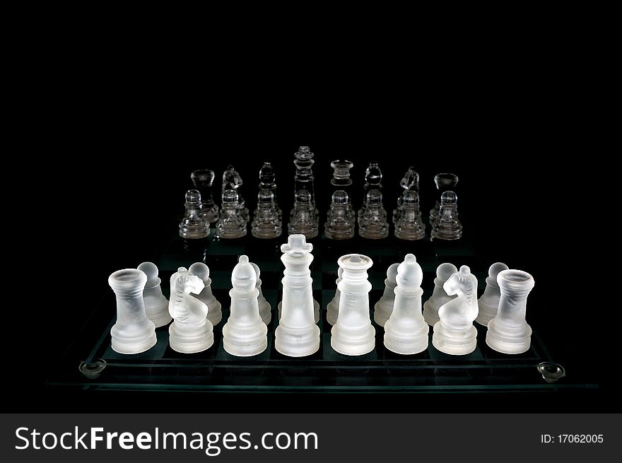 Crystal chess pieces on black background. Crystal chess pieces on black background.