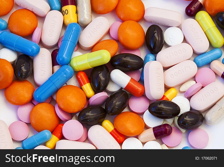 Group of multicolor tablets and capsules