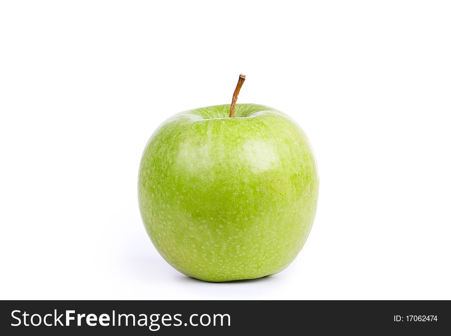 Green apple on white, closed-up