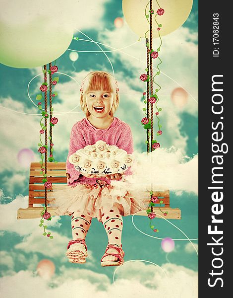 Little girl on the swing in the sky with sweet cake