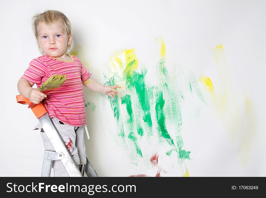 Cute child painting over white