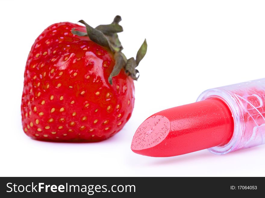 Strawberry and lipstick, closed-up on white