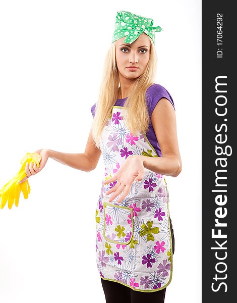 Young beautiful housewife in yellow rubber gloves