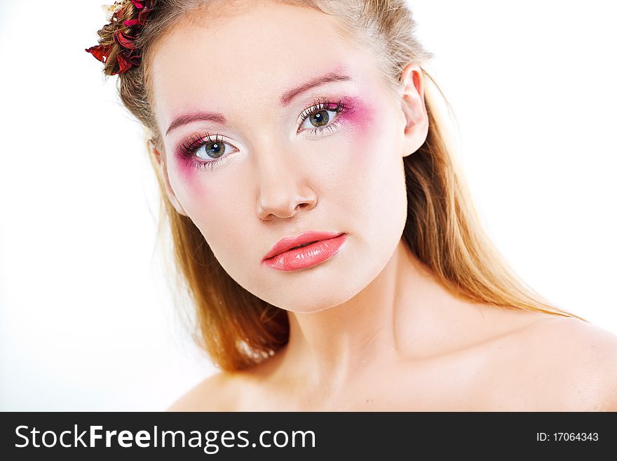 Beautiful face of a glamour woman with modern curly hairstyle and brightly makeup