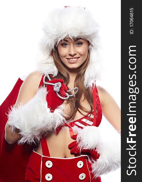 Studio portrait of a young brunette woman dressed as Santa